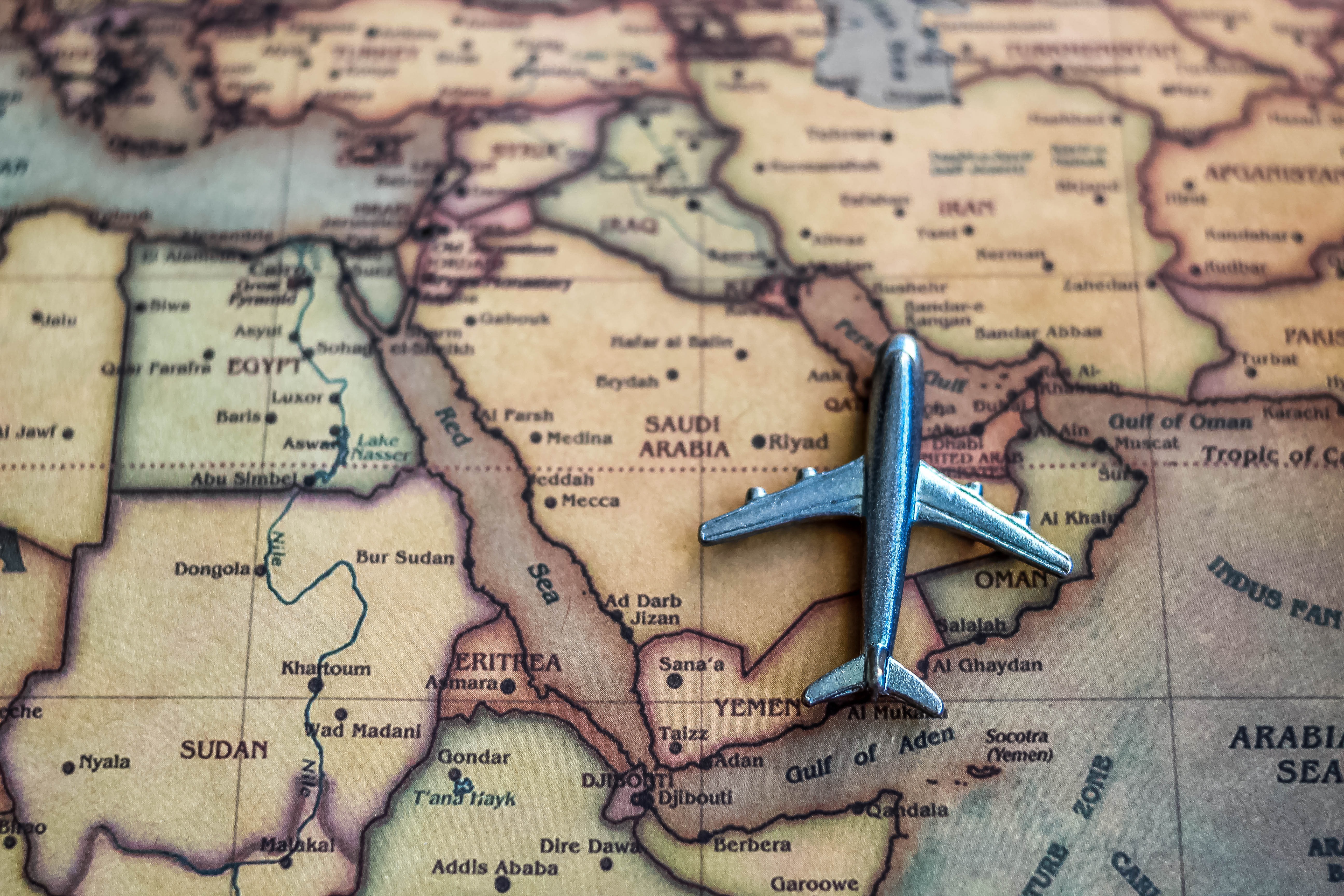 Plane model on Saudi Arabia part of world map.