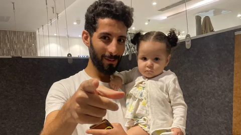 Photo of Ahmed Kamel with child