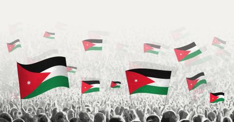 Abstract crowd with flag of Jordan. Peoples protest, revolution, strike and demonstration with flag of Jordan. Vector illustration.