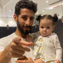 Photo of Ahmed Kamel with child